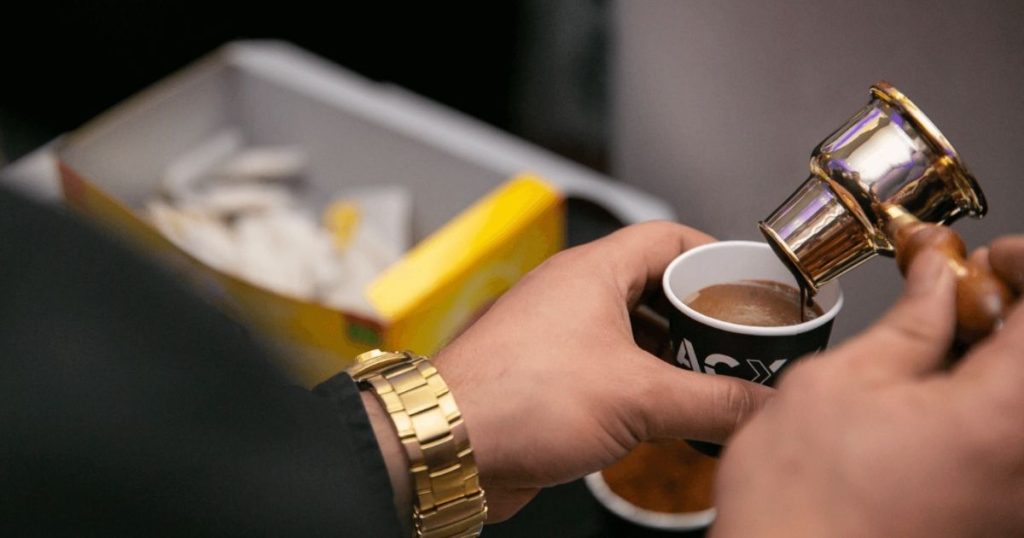 what is a mam account man holding coffee cup